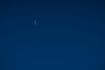 The moon on deep blue sky