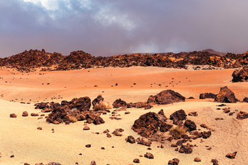 Fototapeta na wymiar Colorful stone lava desert landscape in Teide National Park in Canary islands, Tenerife