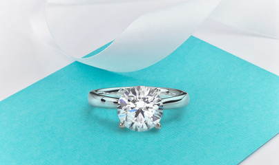 Large Diamond Ring on Turquoise Background