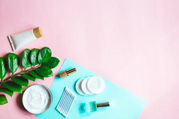  Products for daily skin care and hygiene on a pink background with top view. Natural cosmetics background with top view and space for text. Flatlay 