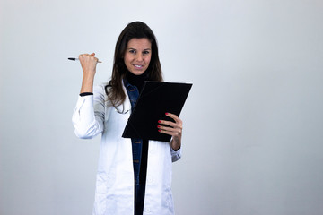Portrait of attractive caucasian middle age woman with a folder in her hands showing thumb up gesture. Nurse, doctor, scientist, therapist, pharmacist, isolated on gray background studio shot, in whit