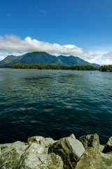 Fototapeta na wymiar Clouds over the mountains at a distance - Tofino, Vancouver Island, BC, Canada