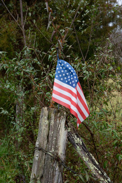 American flag on fence post