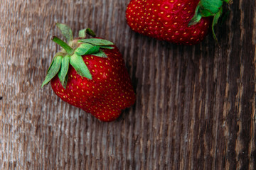 Strawberries on wooden background close-up