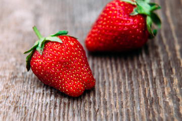Strawberries on wooden background close-up