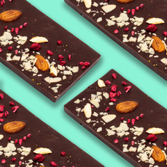 Sweet pattern. Top view handmade chocolate bar with nuts