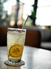 Honey lemon drink on the cafe table Blurred image