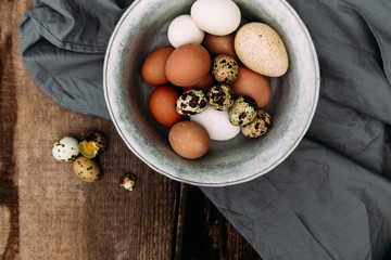 Chicken and quail eggs close-up