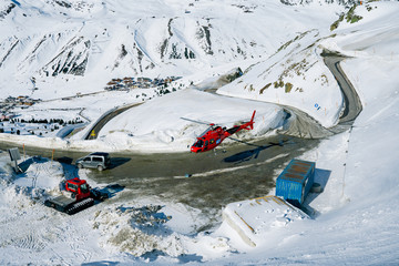 Kuehtai, Tyrol, Austria, Feb 22, 2020: Red helicopter at winter mountains