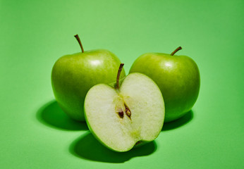 Apple on green background. Flat lay, top view, copy space . Food dietary concept.