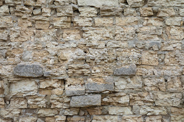 The brown and grey  cobblestone or brick tower, fortress or castle wall background or texture © Майджи Владимир