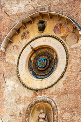 Fototapeta na wymiar The 15th-century Torre del'Orologio or Clock Tower with astronomical clock in Mantova or Mantua, Lombardy, Italy, exterial partial view