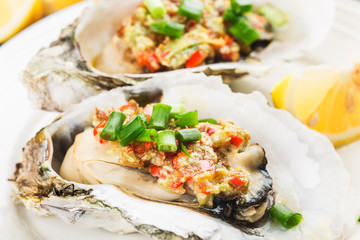 Barbecue overbaked fresh opened oyster with garlic,