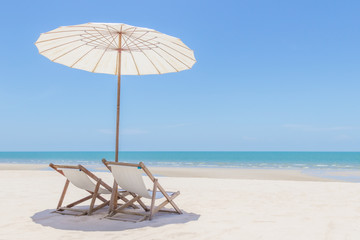 Idyllic tropical beach with white sand, turquoise ocean water and blue sky in huahin thailand
