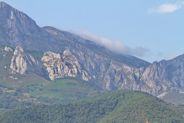 Fototapeta premium Potes, Cantabria/Spain; Aug. 03, 2015. The first peaks of Picos de Europa in Potes.