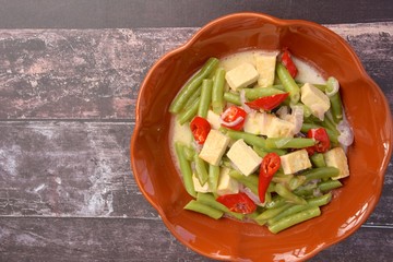 Buncis Tahu kuah santan or green bean tofu with coconut milk. Indonesian food.