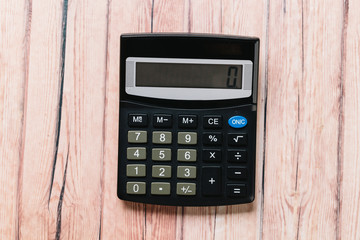 Modern calculator, Business and Finance accounting concept on wooden table