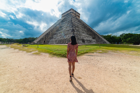 Woman with Chichen Itza Mayan Ruins in the background Yucatan Mexico