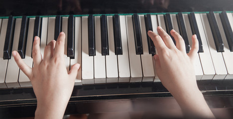Caucasian girl playing piano. Music