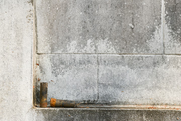used rusty shotgun shell lay on the concrete wall focus on wall
