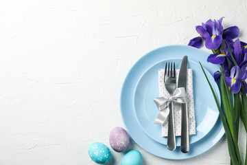Easter table setting on white background, top view