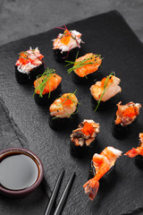 Assorted fresh sushi gunkan maki with seafood