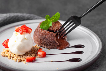 White plate with chocolate fondant cake