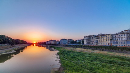 Scenic Sunset Skyline View of Tuscany City, Housing, Buildings and Arno River, Colorful sky, Florence, Italy.