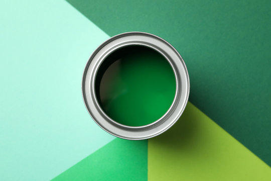 Can Of Green Paint On Multicolored Background, Top View