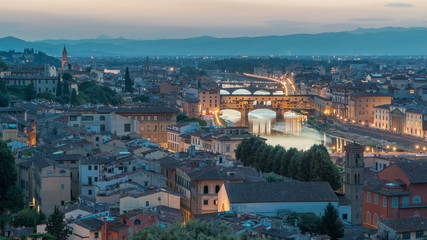 Scenic Skyline View of Arno River day to night timelapse, Ponte Vecchio from Piazzale Michelangelo at Sunset, Florence, Italy.