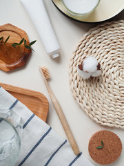 bamboo toothbrush with cotton towel, little plant on the white background. Concept eco friendly, zero waste.