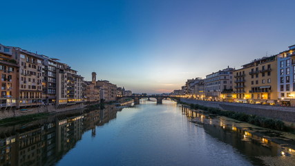 Fototapeta na wymiar Twilight sky scene of Ponte Santa Trinita Holy Trinity Bridge day to night timelapse over River Arno