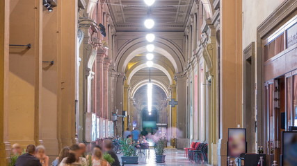 Arcade in building at Republic Square night timelapse with the arch in honor of the first king of...