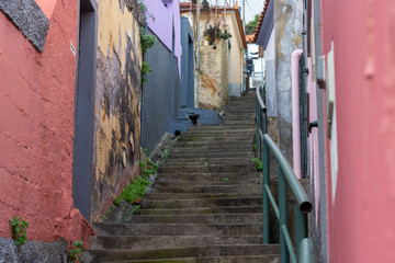 Fototapeta na wymiar Steep staircase up in the old part of the Funchal town.