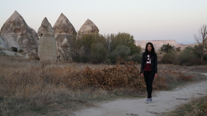 Young woman walking in Cappadocia in Turkey.