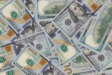 Hundred dollar bills or banknotes background. American money full background close-up and flat lay.