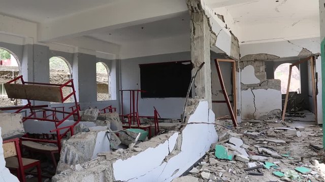 Taiz / Yemen - 04 Feb 2016: destroyed school in Taiz City due to the shelling of missiles by the Arab coalition for Al-Houthi militia which turned the school into a military barracks .