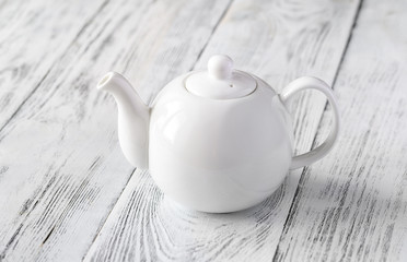 Porcelain teapot with tea