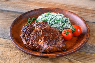 Beef steak with creamy spinach