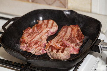 Raw beef steak in grill pan