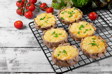 Mini pies with rye dough and mashed potato filling on the metallic lattice. Karelian Kalitki, Russian cuisine meal