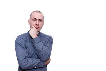 portrait of a young thinking man isolated on white background