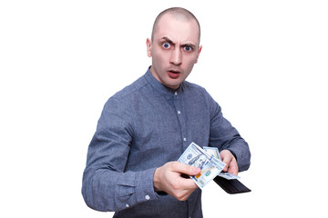 Surprised man with raised eyebrow paying cash