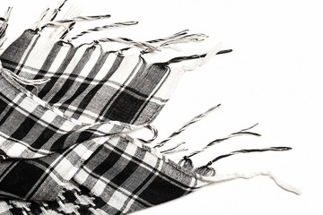 Traditional tissue black and white arabic man's head scarf Shemagh (Keffiyeh). Saudi men’s national headdress called Ghutrah. Close up textile background.