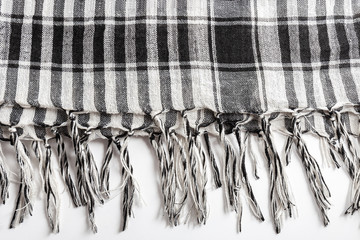 Traditional tissue black and white arabic man's head scarf Shemagh (Keffiyeh). Saudi men’s national headdress called Ghutrah. Close up textile background.