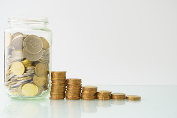 high key. business and finance management conceptual images. stacked money with glass bottle of...