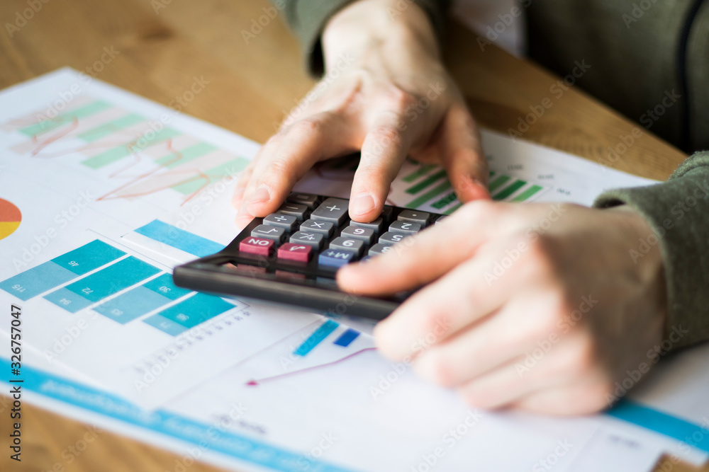 Poster businessman working with financial diagram document with chart and tables closeup.