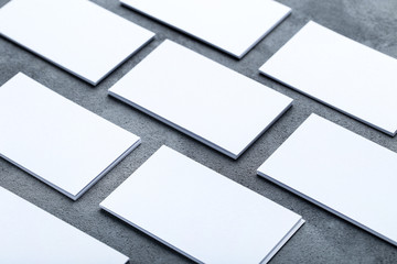Blank business cards on grey background