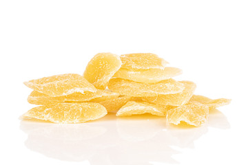 Lot of slices of dried yellow pineapple stack isolated on white background