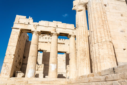 Ruined columns of the Propylaea monumental gateway to the Acropolis of Athens in Greece.